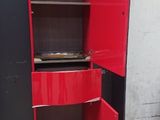 an image of a red metal cabinet with a door open