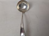 a silver spoon with a spoon handle on it
