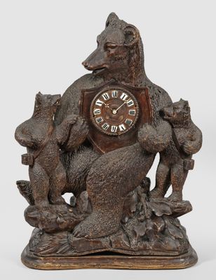 a wooden clock with a bear and two cats on it
