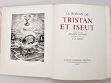 an open book with a drawing of a boat in the ocean