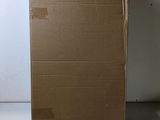 an open cardboard box sitting on top of a white counter