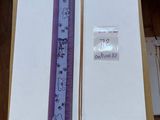 a ruler and a ruler on a table next to a piece of paper