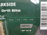 a package of metal bullet bits in a plastic package