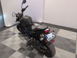 a motorcycle that is sitting on a checkered floor
