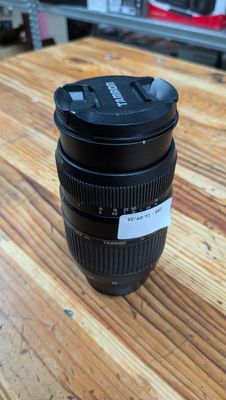 a close up of a camera lens sitting on a wooden table
