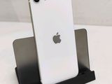 a white iphone sitting on top of a black stand