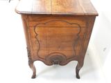a small wooden table with a drawer on top of it