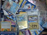 a box full of pokemon cards sitting on the floor