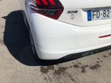 a white car that is parked in a parking lot