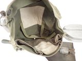 a backpack with a lid on it and a bowl in the back
