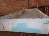 a blue paint on the side of a white box