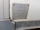 a metal plaque on the side of a white truck