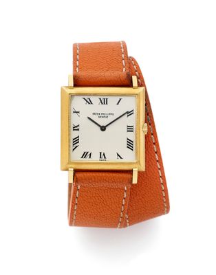 une montre-bracelet en or jaune 18 carats avec des chiffres romains