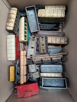 a box full of different types of toy trains in it