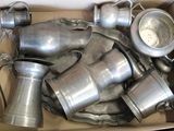 a cardboard box full of old metal items in it