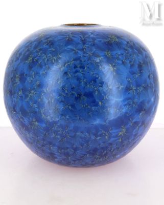 a blue vase that is sitting on a table