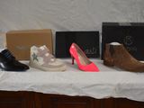 several pairs of shoes are lined up on a table