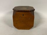 an old wooden box sitting on a white surface with a white background