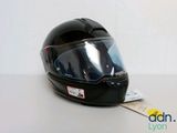 a black helmet on a table with a tag on it