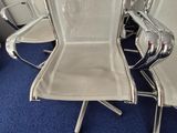 a lot of chairs that are lined up in a room