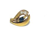 an image of a close up of a gold ring with a blue stone