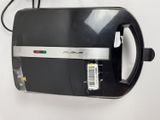 an image of a black and silver toaster sitting on top of a white wall