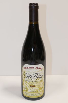 a bottle of wine that is sitting on a table