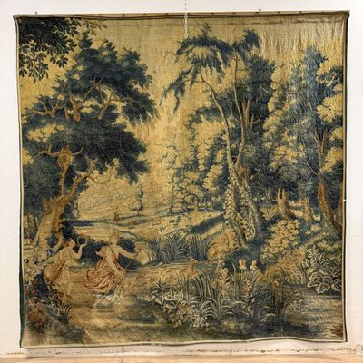 a tapestry hanging on the wall of a room