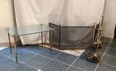 pair of brass and glass side tables with a glass top