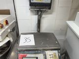 an image of a scale in a kitchen with a number on it