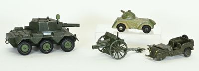 four toy vehicles that are sitting next to each other