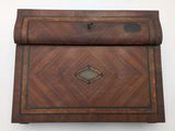 an old wooden box with a decorative design on it