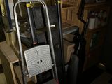 a ladder that is next to a chair in a room