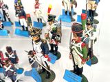 many figurines of soldiers on display in a display case