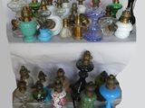 many different types of glass vases on a shelf