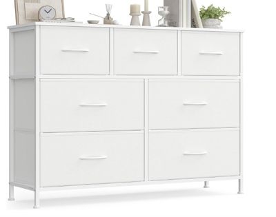 a white dresser with drawers and a mirror on top of it