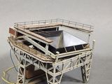 a small model of a building with a roof on it