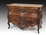 an old wooden chest of drawers with carvings on the drawers