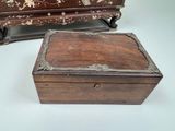 a small wooden box sitting next to a smaller wooden box