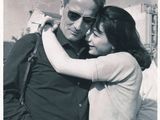 black and white photograph of a man and woman hugging each other