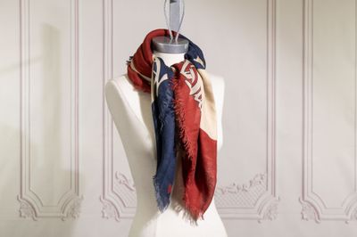 a mannequin with a red, white and blue scarf on it