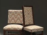 pair of chairs with upholstered back and upholstered seat