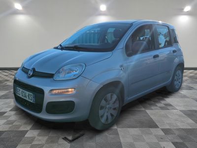 a picture of a small blue car parked in a garage