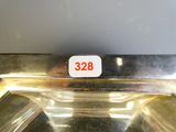 a silver plate with a number on it on a table