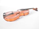 an old violin sitting on a white surface with a white background
