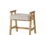 the back of a wooden bench with a seat made of fabric