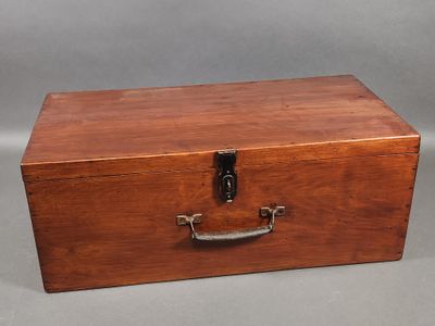 an old wooden box with a metal handle on a gray background