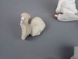 two figurines that are sitting on a table
