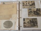 an old photo album with a lot of old photos on it