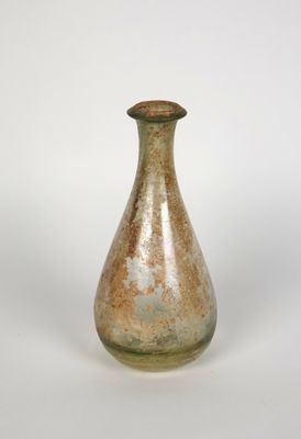 a glass vase that is sitting on a white surface